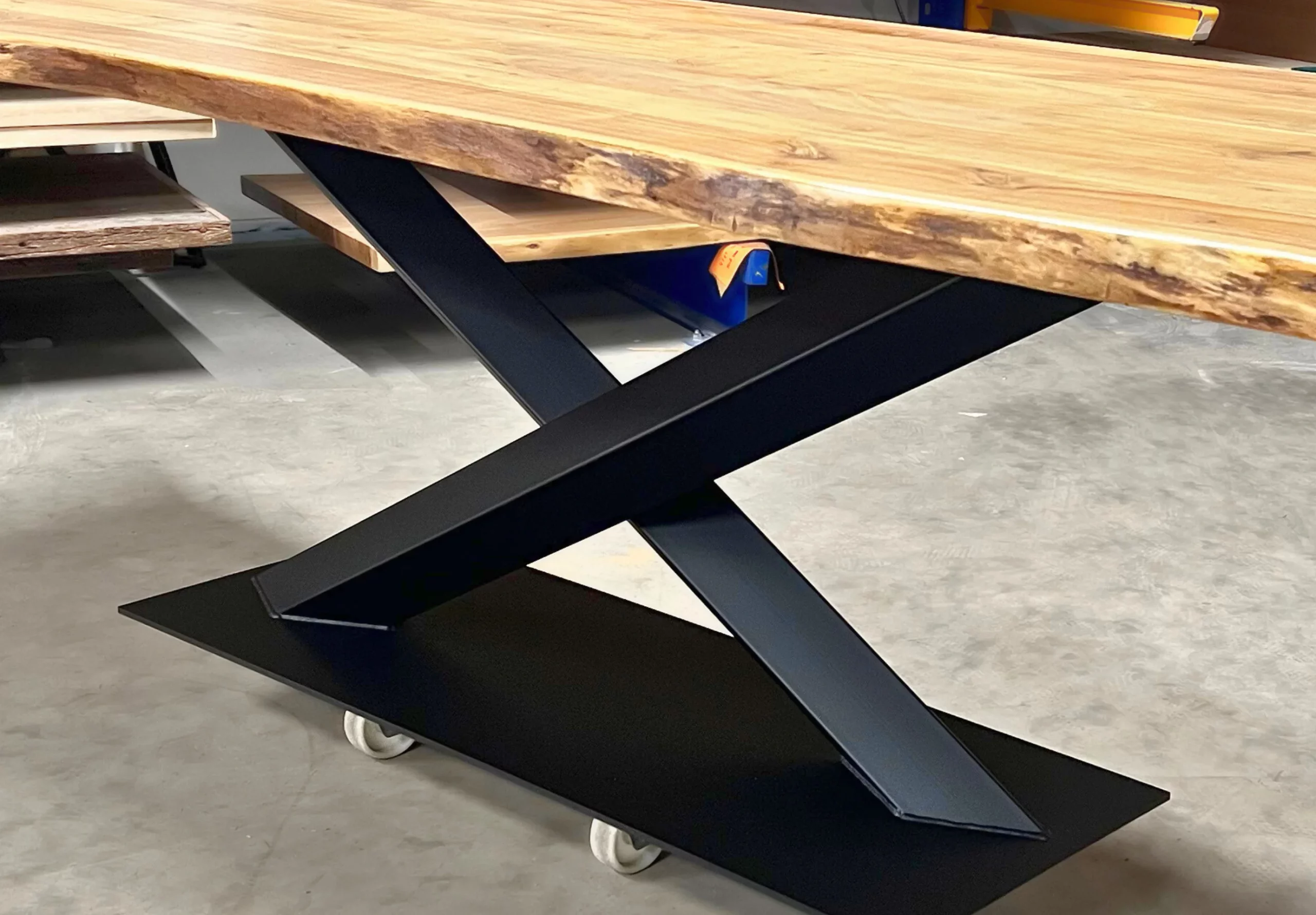 A central black steel leg