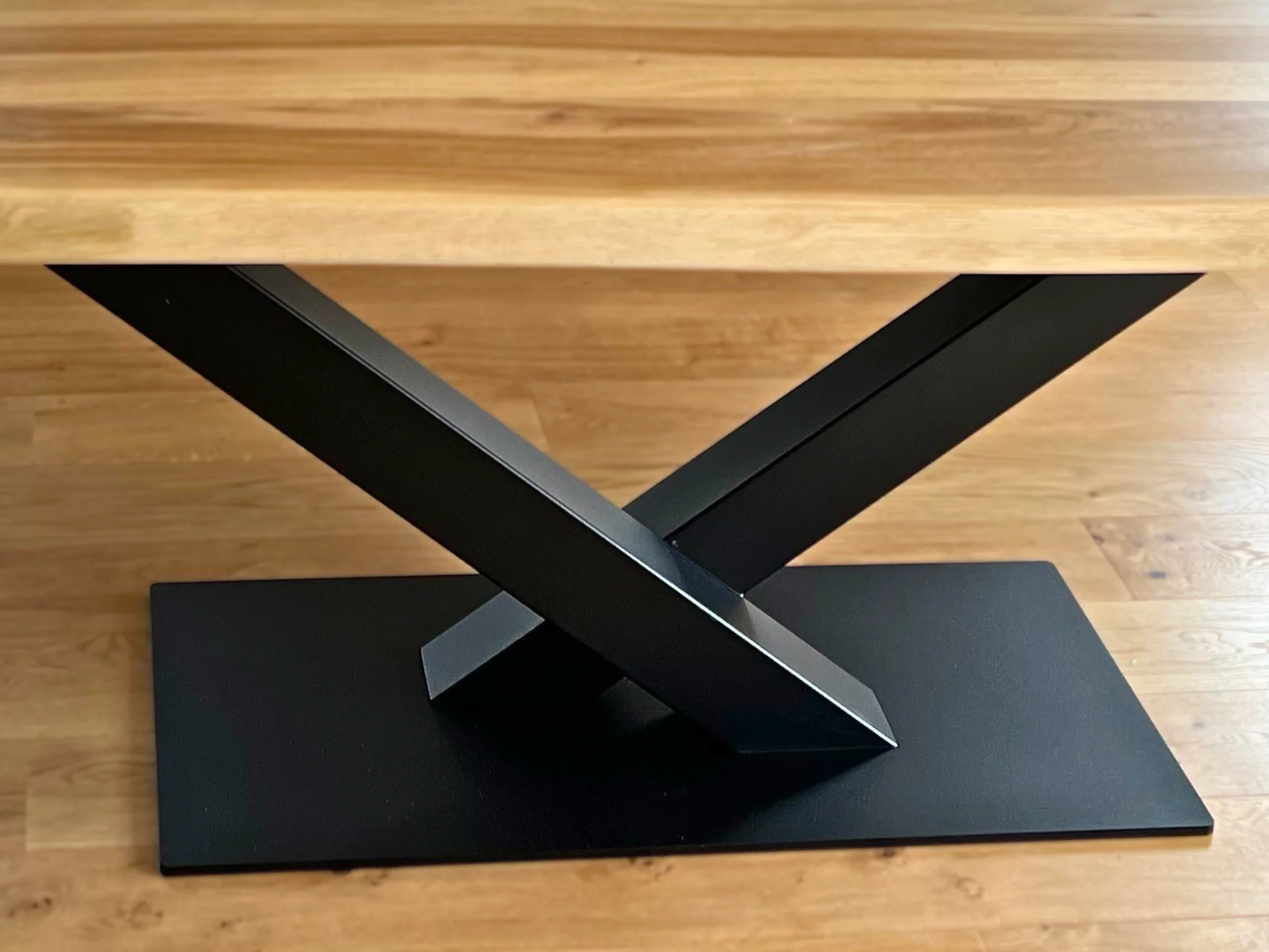A black steel dining table leg