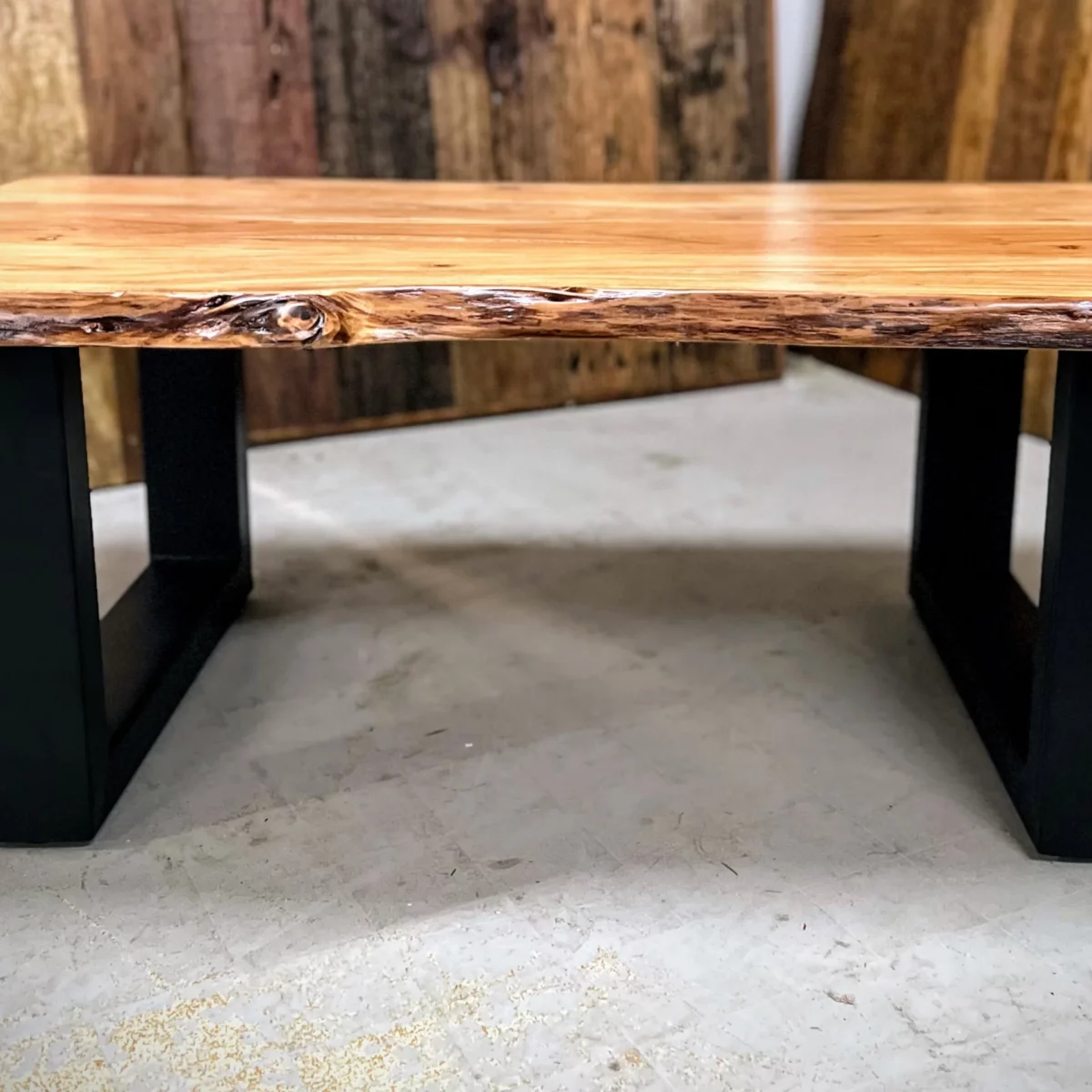 A workshop with a coffee table with U-shaped legs