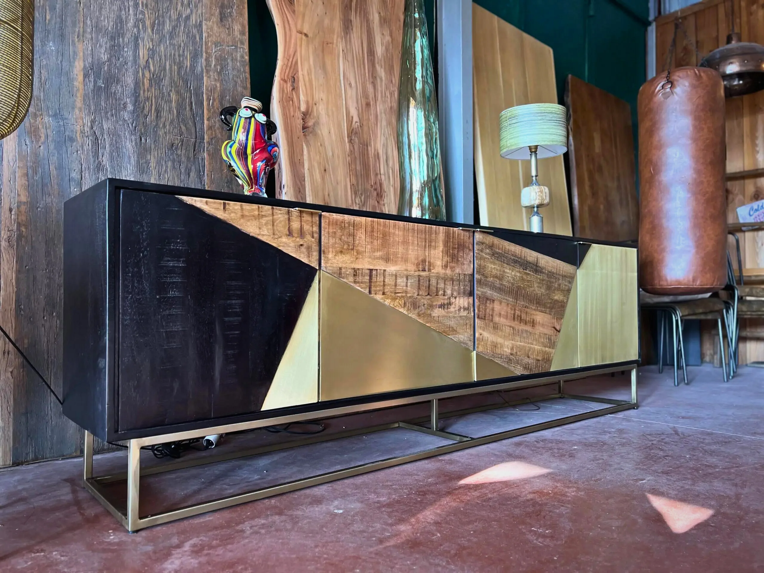 A wooden and metal cabinet in a shop