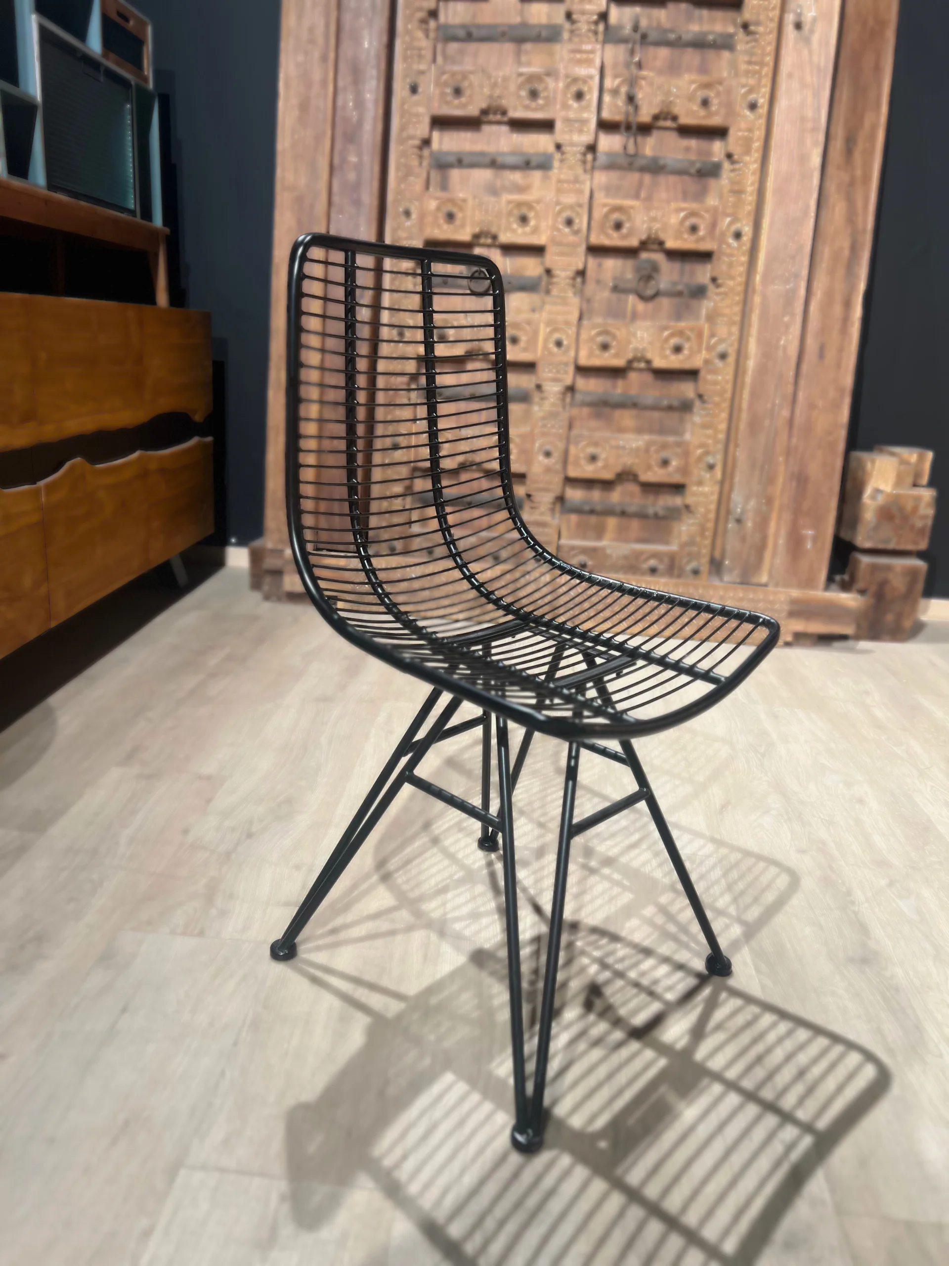 A black metal industrial chair