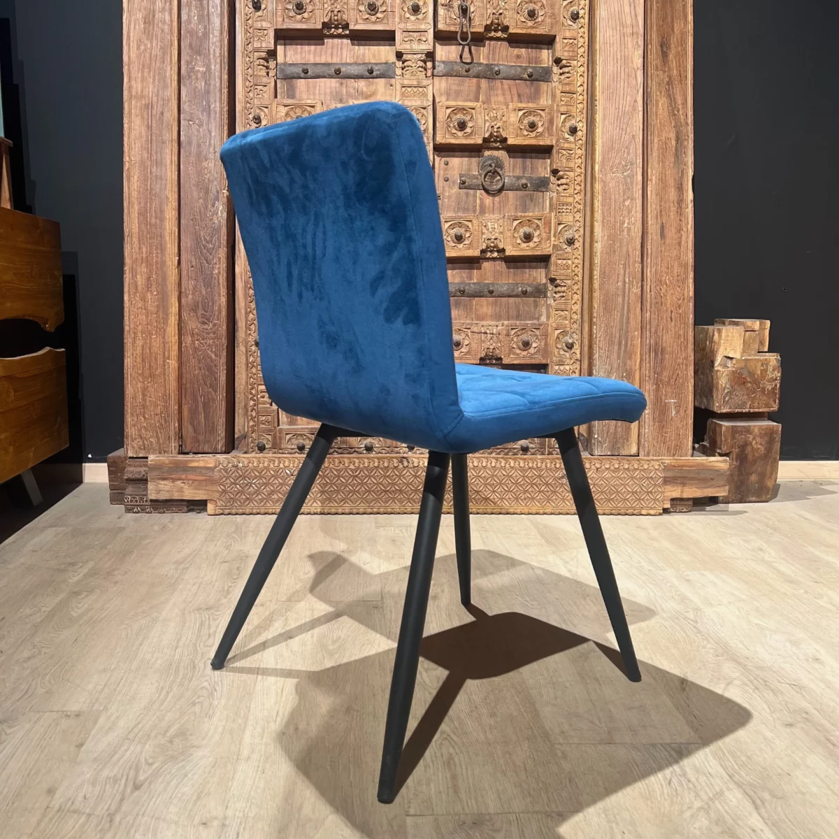 A blue velvet chair