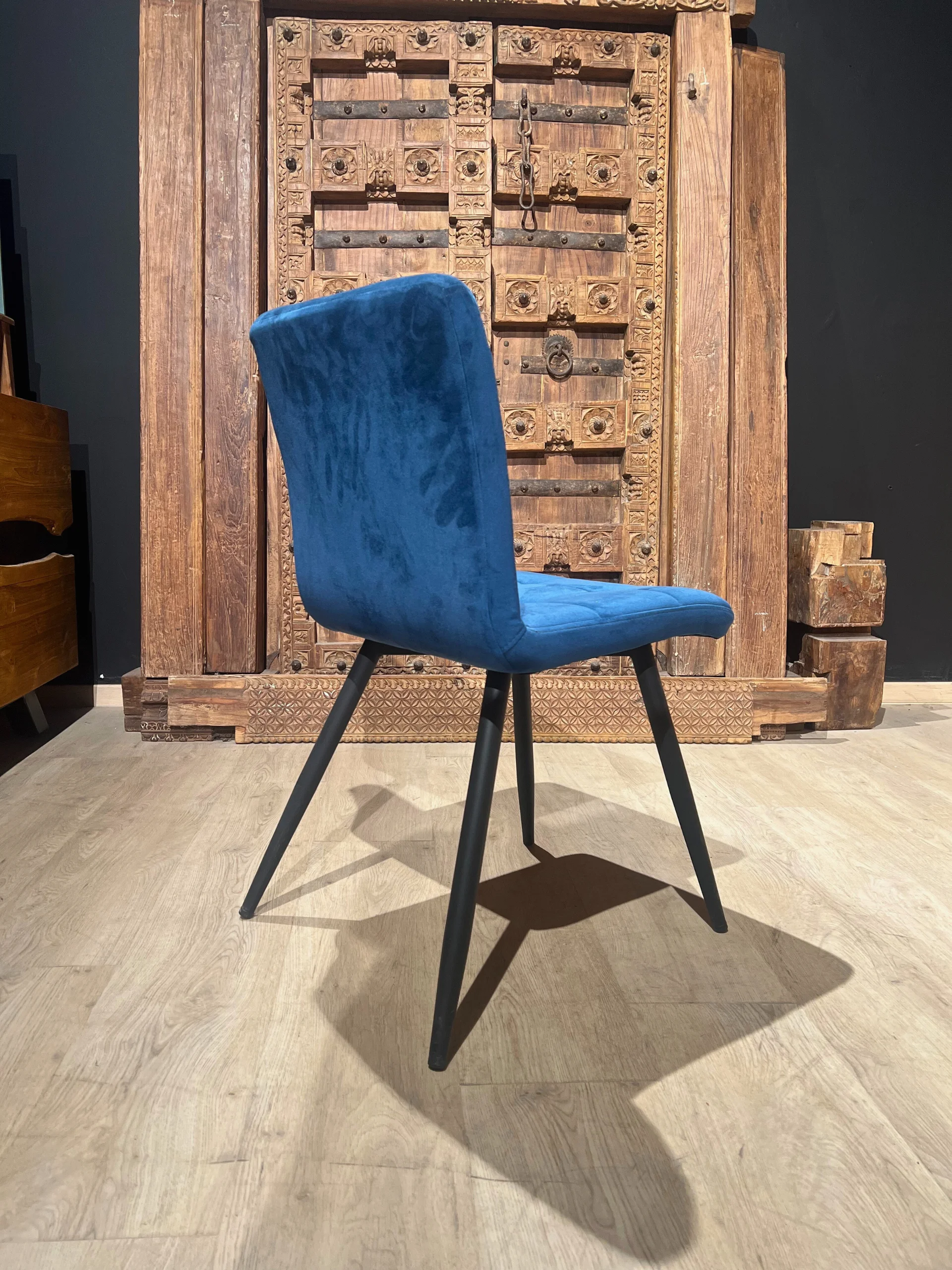 A blue velvet chair
