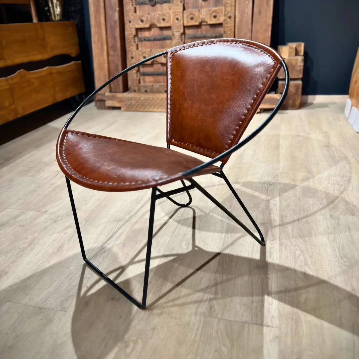 A contemporary metal armchair in a workshop