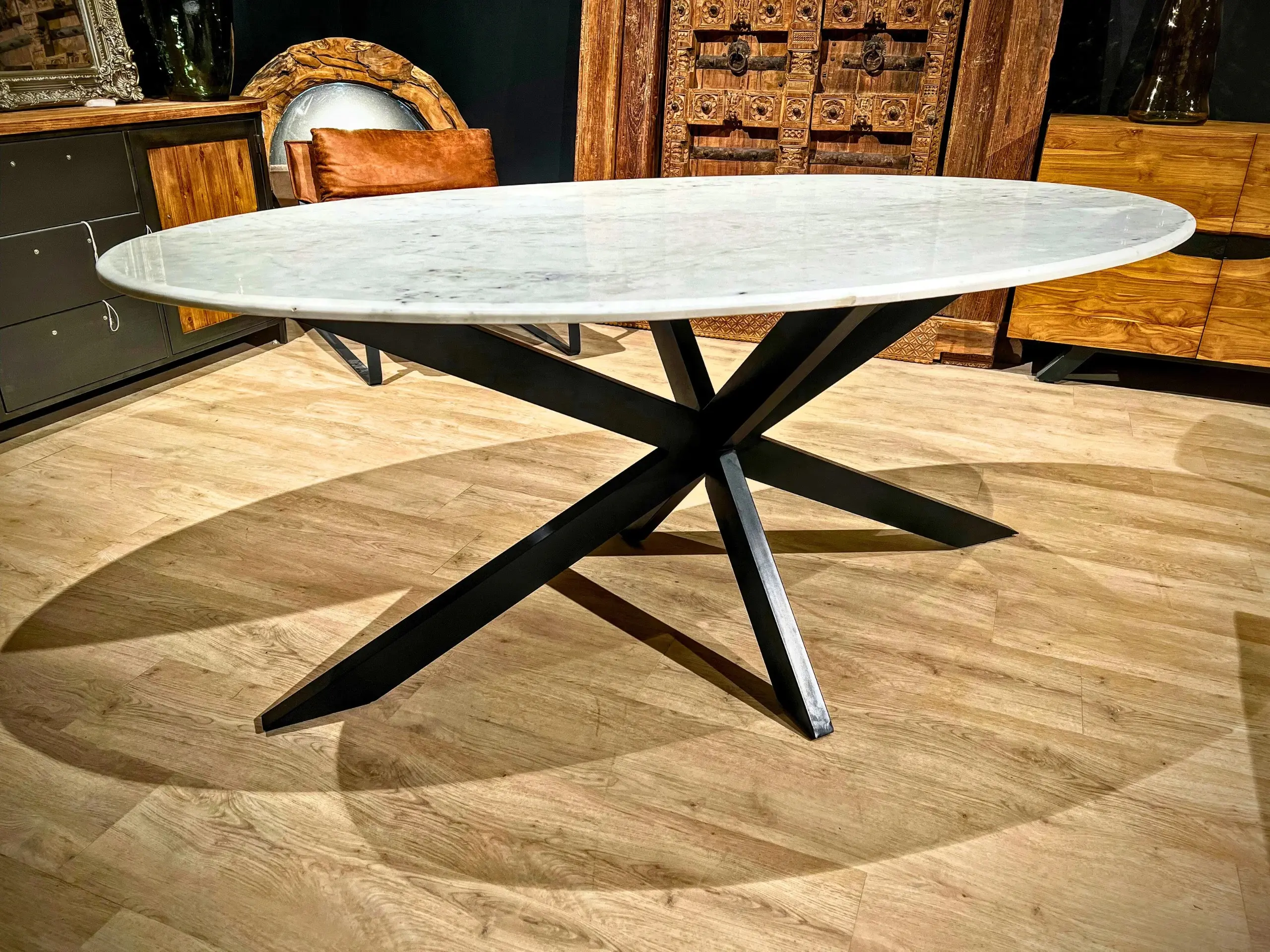 A large white marble oval table