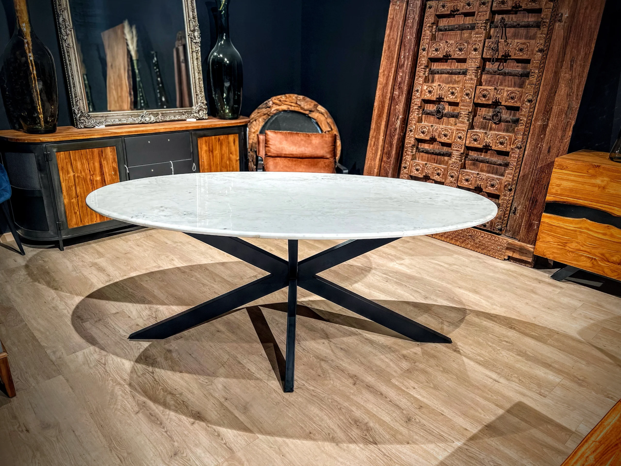 A large white marble oval table