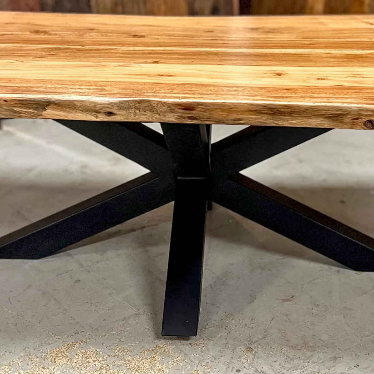 A coffee table with a central star base