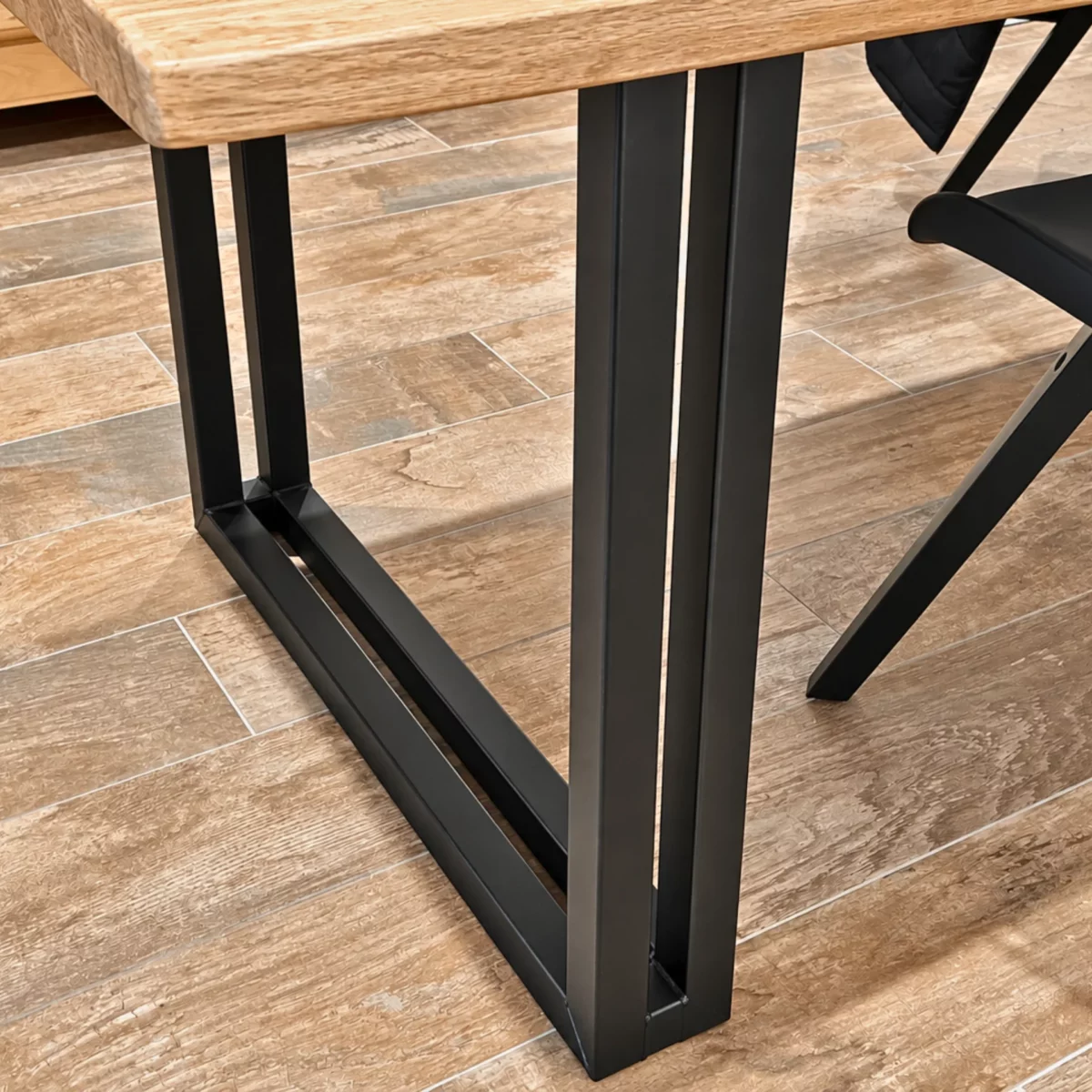 A U-shaped table leg made of steel