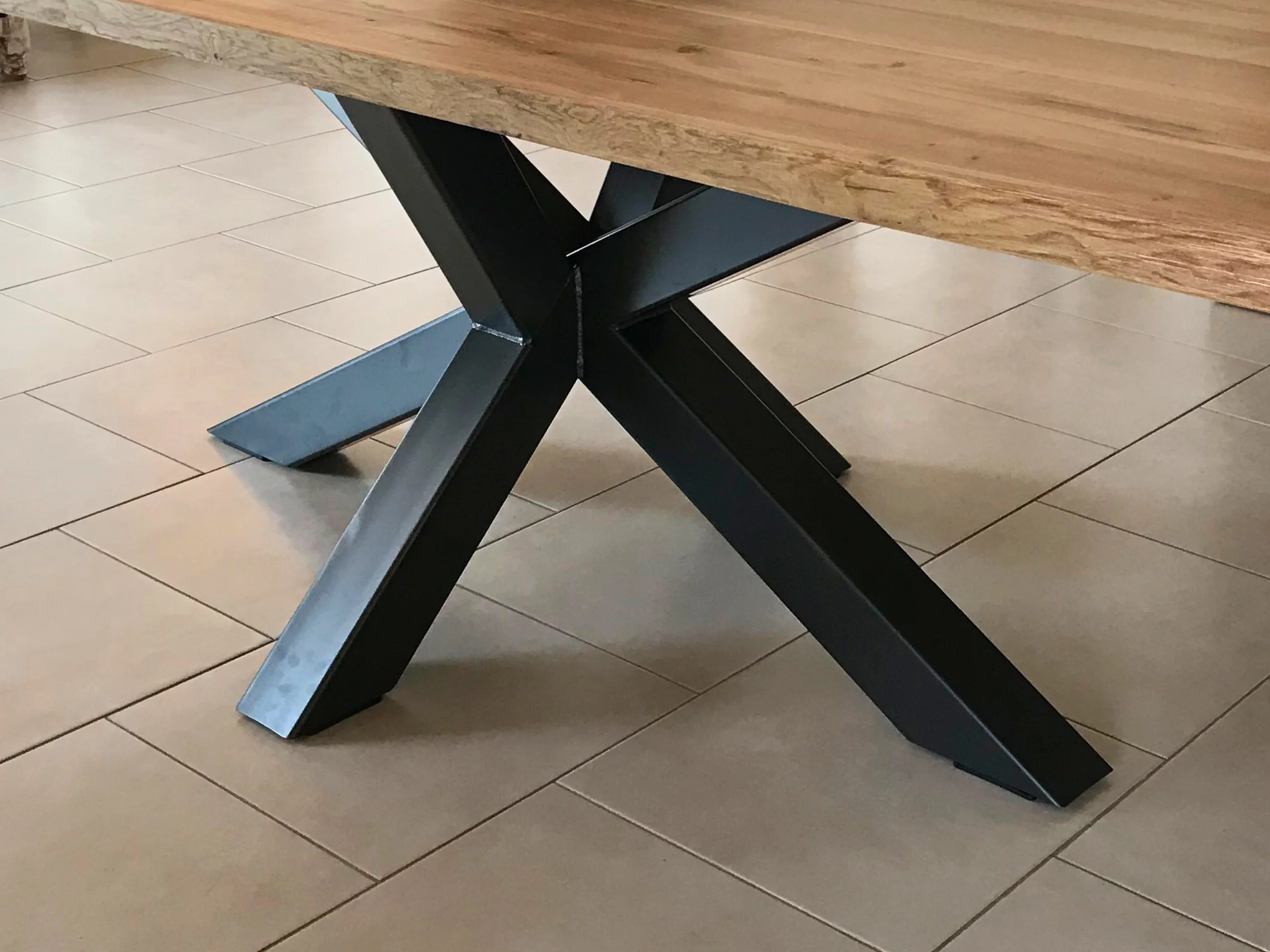 A massive black metal table leg