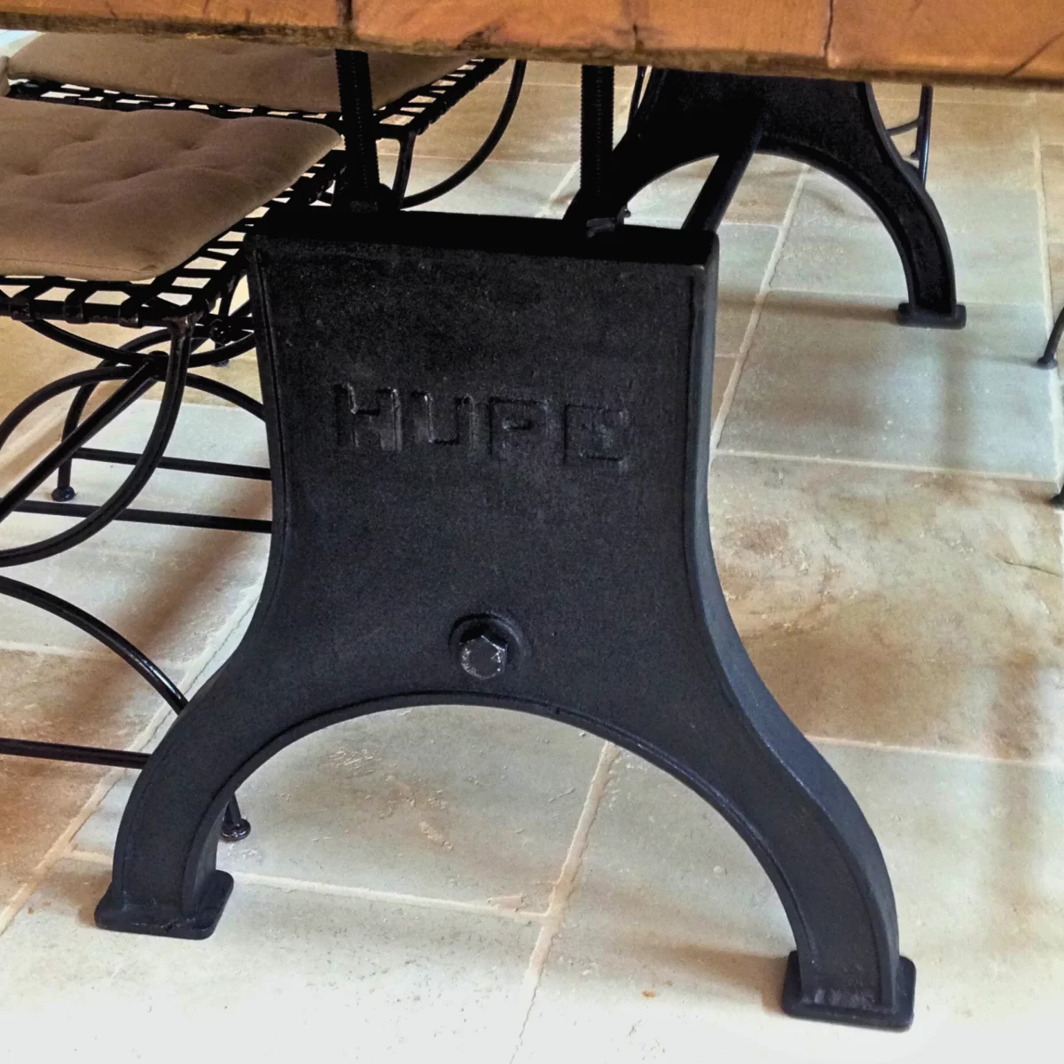 A cast iron dining table leg