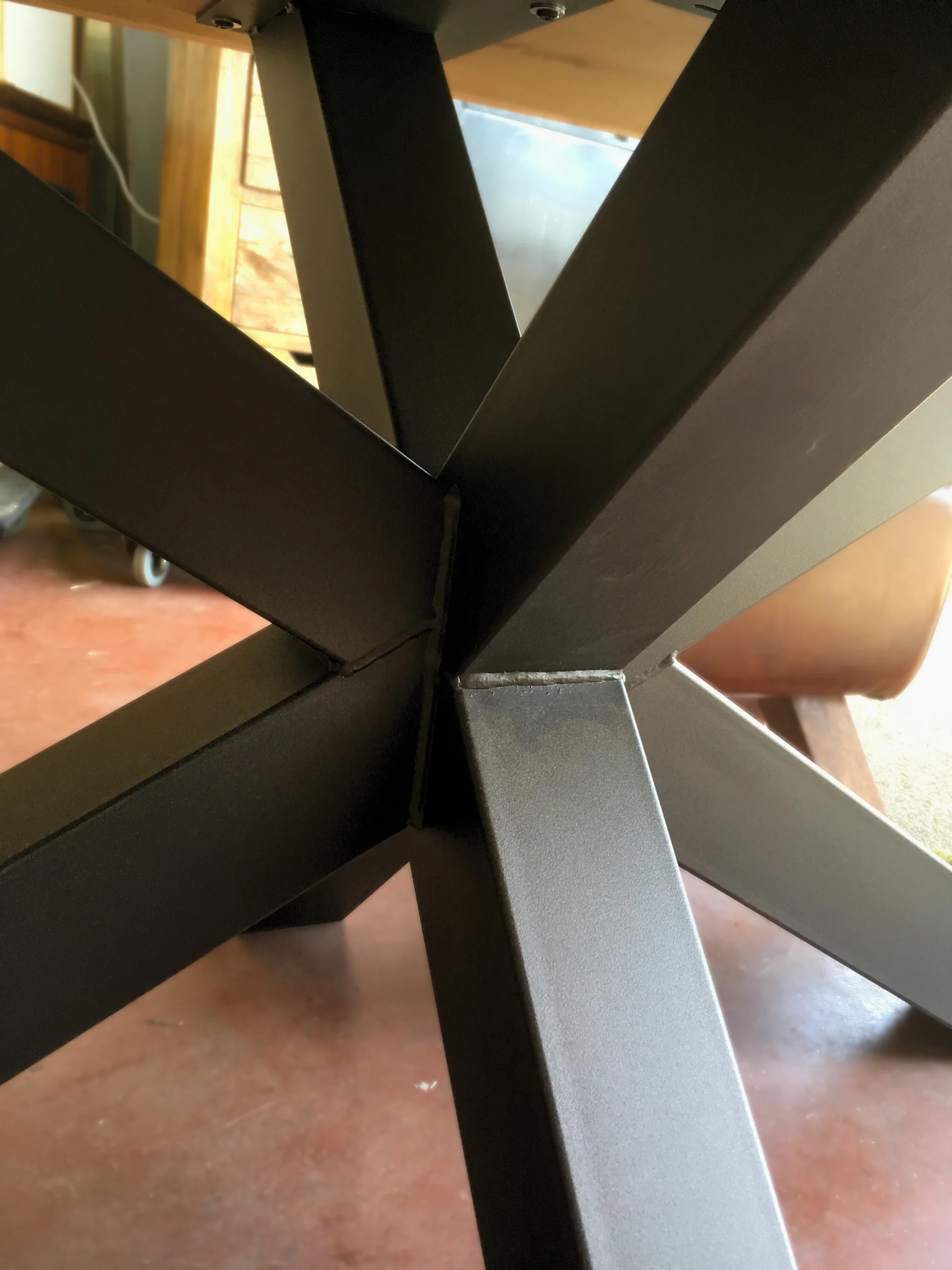 The details of a black metal table leg