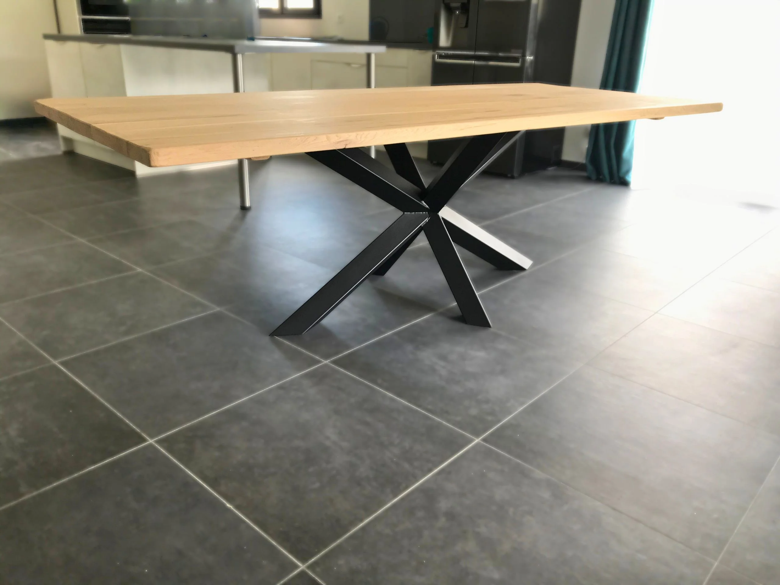A large modern dining table in a kitchen