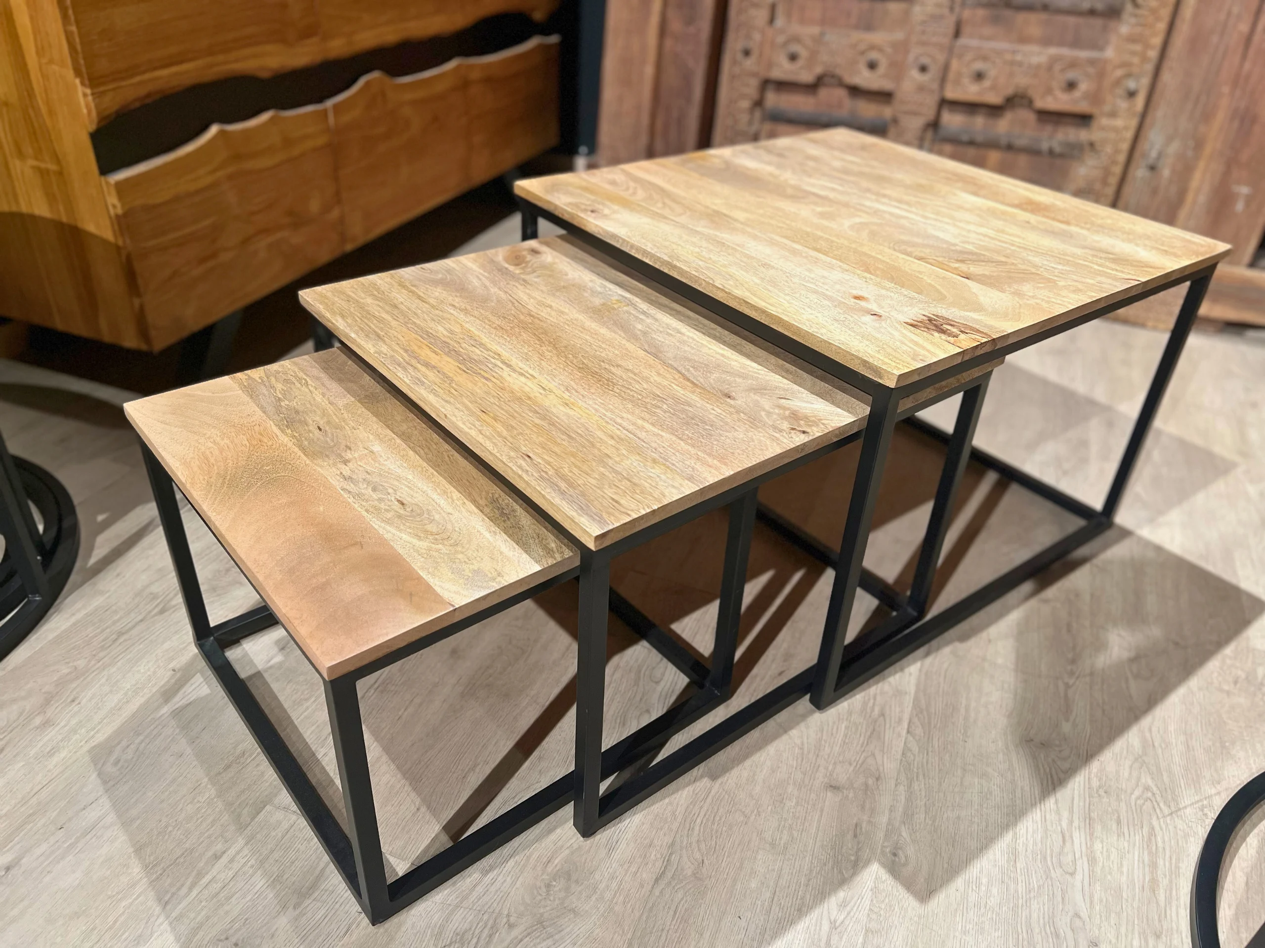 A set of nesting wooden coffee tables