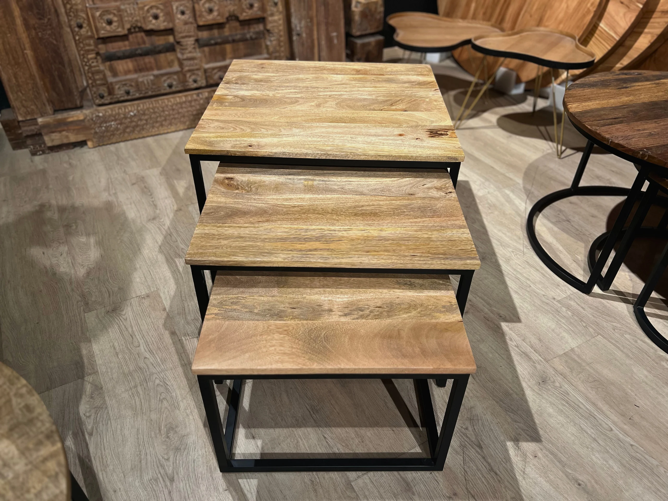 A set of wooden nesting tables