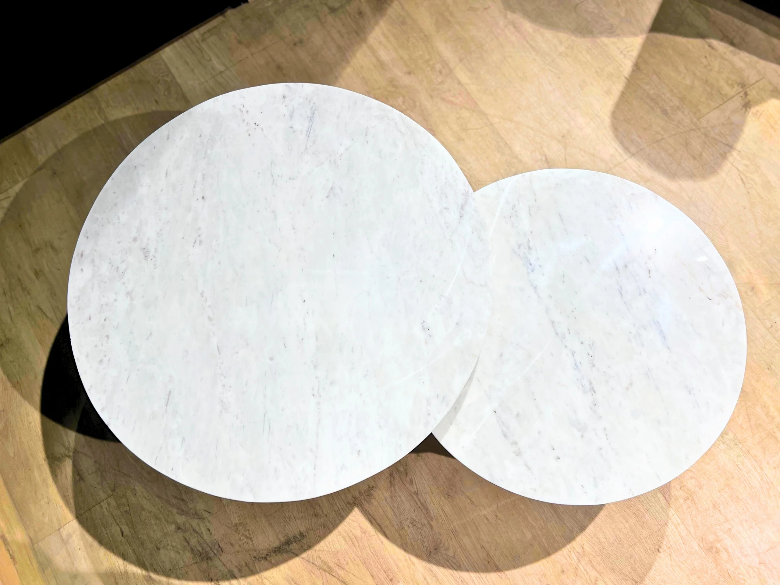 Two round marble coffee tables
