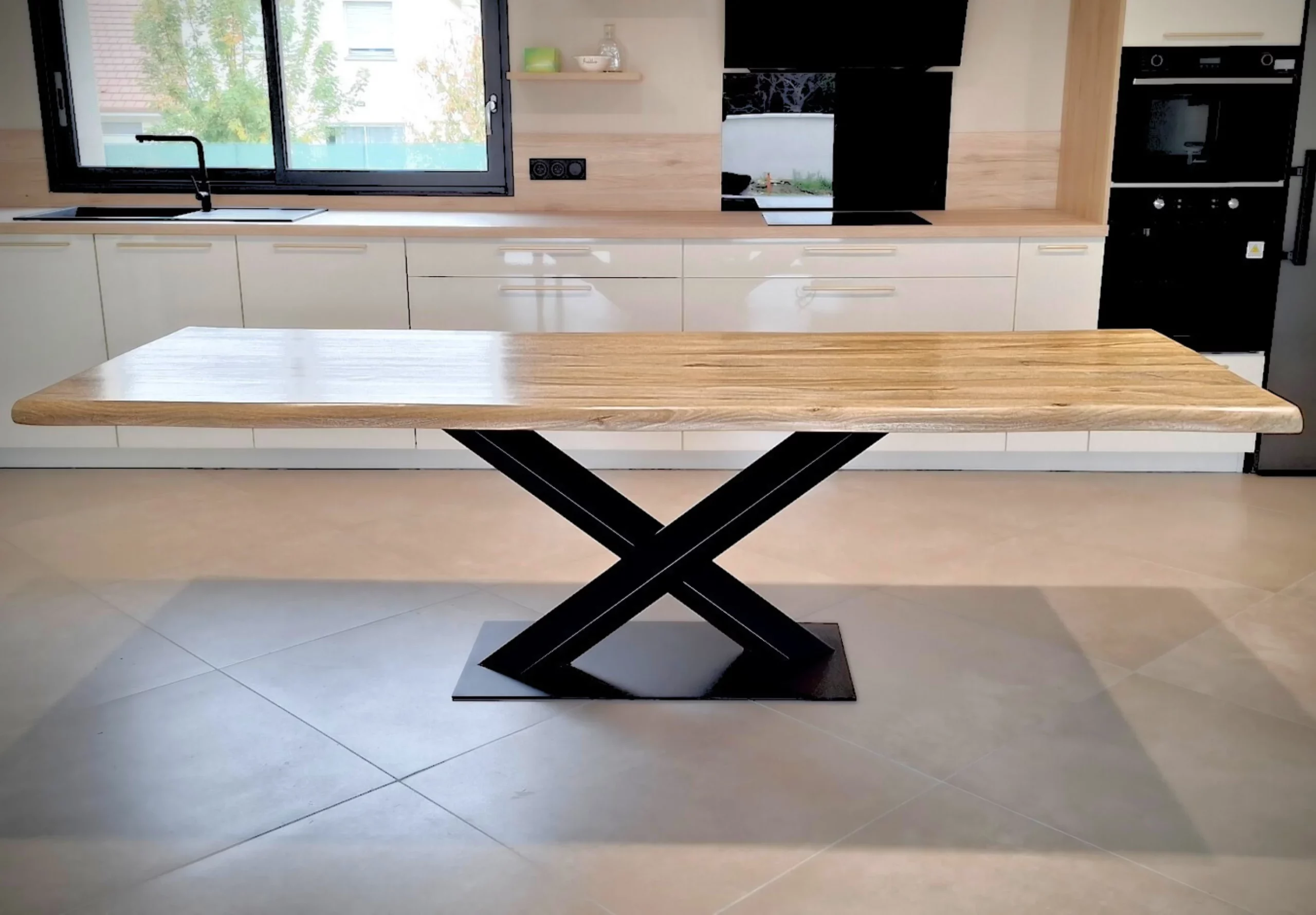 A wooden table with a central pedestal